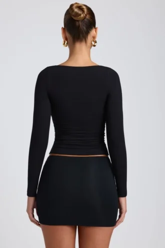 Top a maniche lunghe con ruches Emry in modal nero