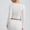 Top a maniche lunghe con ruches in modal Alia, colore bianco Top a maniche lunghe con ruches in modal Alia, colore bianco