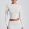 Top a maniche lunghe con ruches in modal Alia, colore bianco Top a maniche lunghe con ruches in modal Alia, colore bianco