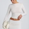 Top a maniche lunghe con ruches in modal Alia, colore bianco Top a maniche lunghe con ruches in modal Alia, colore bianco