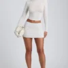Top a maniche lunghe con ruches in modal Alia, colore bianco Top a maniche lunghe con ruches in modal Alia, colore bianco