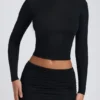 Top a maniche lunghe con ruches in modal Alia, nero Top a maniche lunghe con ruches in modal Alia, nero