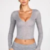 Top a maniche lunghe con scollo profondo in jersey trasparente Liah, colore grigio Top a maniche lunghe con scollo profondo in jersey trasparente Liah, colore grigio
