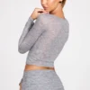 Top a maniche lunghe con scollo profondo in jersey trasparente Liah, colore grigio Top a maniche lunghe con scollo profondo in jersey trasparente Liah, colore grigio
