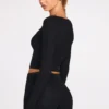 Top a reggiseno con lacci a maniche lunghe in modal a coste Margaux in nero Top a reggiseno con lacci a maniche lunghe in modal a coste Margaux in nero