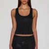 Top Aine in jersey con scollo rotondo e dorso a vogatore, decorato, in nero Top Aine in jersey con scollo rotondo e dorso a vogatore, decorato, in nero