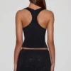 Top Aine in jersey con scollo rotondo e dorso a vogatore, decorato, in nero Top Aine in jersey con scollo rotondo e dorso a vogatore, decorato, in nero