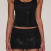 Top Aine in jersey con scollo rotondo e dorso a vogatore, decorato, in nero Top Aine in jersey con scollo rotondo e dorso a vogatore, decorato, in nero