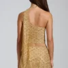 Top asimmetrico con dettagli a sciarpa decorato Cosette in oro Top asimmetrico con dettagli a sciarpa decorato Cosette in oro