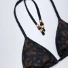 Top bikini a triangolo Comoros con dettagli decorativi in nero Top bikini a triangolo Comoros con dettagli decorativi in nero