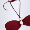Top bikini con scollo all’americana e dettagli in metallica Savai in ciliegia scura Top bikini con scollo all’americana e dettagli in metallica Savai in ciliegia scura