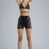 Top bikini con spalline incrociate e decorazioni Liberty in nero Top bikini con spalline incrociate e decorazioni Liberty in nero