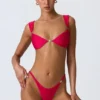 Top bikini decorato Coquina in rosa lampone Top bikini decorato Coquina in rosa lampone