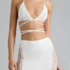 Top bikini Liberty con spalline incrociate e decorazioni in avorio Top bikini Liberty con spalline incrociate e decorazioni in avorio