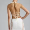 Top bikini Liberty con spalline incrociate e decorazioni in avorio Top bikini Liberty con spalline incrociate e decorazioni in avorio