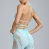 Top bikini Liberty con spalline incrociate e decorazioni in blu ghiaccio Top bikini Liberty con spalline incrociate e decorazioni in blu ghiaccio