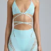 Top bikini Liberty con spalline incrociate e decorazioni in blu ghiaccio Top bikini Liberty con spalline incrociate e decorazioni in blu ghiaccio