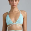 Top bikini Liberty con spalline incrociate e decorazioni in blu ghiaccio Top bikini Liberty con spalline incrociate e decorazioni in blu ghiaccio