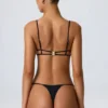 Top bikini nero con cut-out e decorazioni a catena Sanibel Top bikini nero con cut-out e decorazioni a catena Sanibel