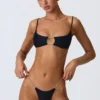Top bikini nero con cut-out e decorazioni a catena Sanibel Top bikini nero con cut-out e decorazioni a catena Sanibel