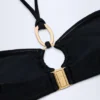 Top bikini Savai con dettagli metallici e arricciature, nero Top bikini Savai con dettagli metallici e arricciature, nero