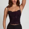 Top con collo a cappuccio e decorazioni Armelia in serpente viola Top con collo a cappuccio e decorazioni Armelia in serpente viola