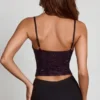 Top con collo a cappuccio e decorazioni Armelia in serpente viola Top con collo a cappuccio e decorazioni Armelia in serpente viola