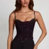 Top con collo a cappuccio e decorazioni Armelia in serpente viola Top con collo a cappuccio e decorazioni Armelia in serpente viola