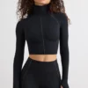 Top corto a collo alto Soft Active in nero