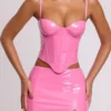 Top corto a corsetto con ferretti in vinile Cassandra, rosa Top corto a corsetto con ferretti in vinile Cassandra, rosa