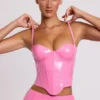 Top corto a corsetto con ferretti in vinile Cassandra, rosa Top corto a corsetto con ferretti in vinile Cassandra, rosa