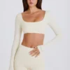 Top corto a maniche lunghe color crema