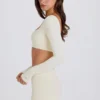 Top corto a maniche lunghe color crema