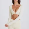 Top corto a maniche lunghe color crema