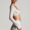 Top corto a maniche lunghe con decorazioni Lumina in bianco Top corto a maniche lunghe con decorazioni Lumina in bianco