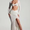 Top corto a maniche lunghe con decorazioni Lumina in bianco Top corto a maniche lunghe con decorazioni Lumina in bianco