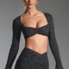 Top corto a maniche lunghe con decorazioni Lumina in nero Top corto a maniche lunghe con decorazioni Lumina in nero