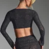 Top corto a maniche lunghe con decorazioni Lumina in nero Top corto a maniche lunghe con decorazioni Lumina in nero