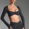 Top corto a maniche lunghe con decorazioni Lumina in nero Top corto a maniche lunghe con decorazioni Lumina in nero