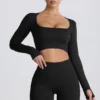 Top corto a maniche lunghe senza cuciture Super Sculpt in nero Top corto a maniche lunghe senza cuciture Super Sculpt in nero