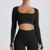 Top corto a maniche lunghe senza cuciture Super Sculpt in nero Top corto a maniche lunghe senza cuciture Super Sculpt in nero