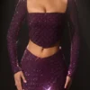 Top corto asimmetrico con decorazioni Thora in viola intenso Top corto asimmetrico con decorazioni Thora in viola intenso