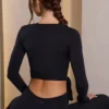 Top corto avvolgente in jersey morbido nero Top corto avvolgente in jersey morbido nero
