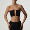 Top corto con cut-out decorato Ariana in nero Top corto con cut-out decorato Ariana in nero