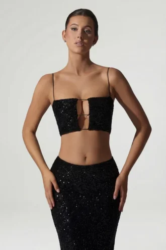 Top corto con cut-out decorato Ariana in nero