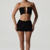 Top corto con cut-out decorato Ariana in nero Top corto con cut-out decorato Ariana in nero
