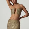 Top corto con cut-out decorato Ariana in oro Top corto con cut-out decorato Ariana in oro