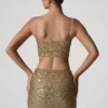 Top corto con cut-out decorato Ariana in oro Top corto con cut-out decorato Ariana in oro