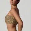 Top corto con cut-out decorato Ariana in oro Top corto con cut-out decorato Ariana in oro