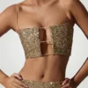 Top corto con cut-out decorato Ariana in oro Top corto con cut-out decorato Ariana in oro